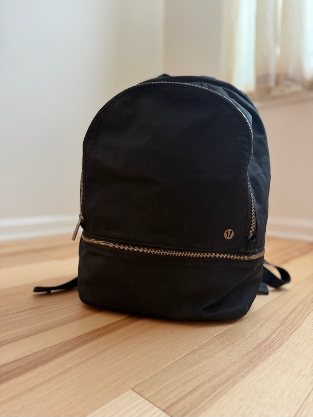 lululemon athletica Black Minimalist Backpack with Gold Accents